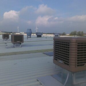 Evaporating cooling units located on an industrial roof.