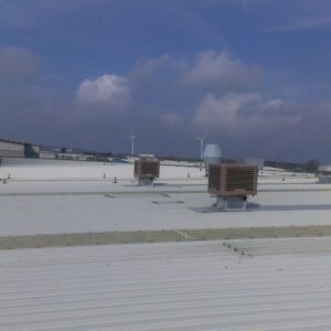 Evaporative cooling units on an industrial roof.
