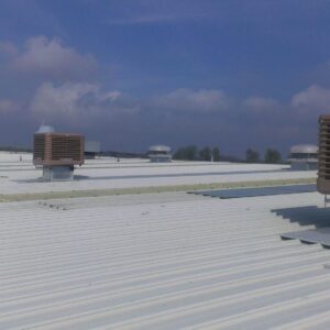 Evaporative cooling units on an industrial roof.