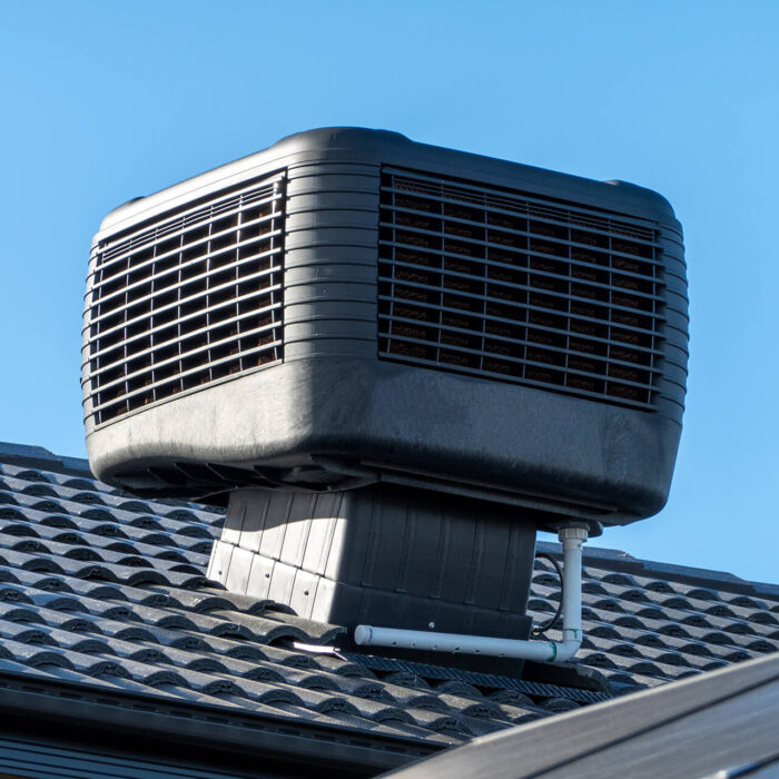 An evaporating cooler unit on a roof.