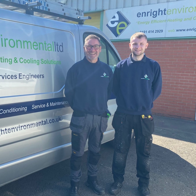 Jason and Ellis Enright standing in front of Enright Environmental van