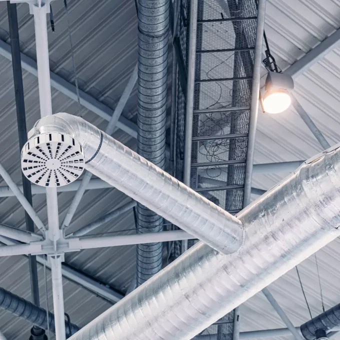 Ventilation pipes hvac duct tube hanging from ceiling store inside for conditioner air.