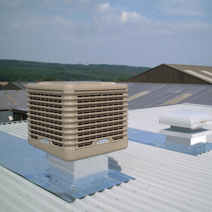 An evaporative cooling system installed on the roof of an industrial building.