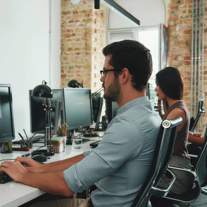 Employees working comfortably in an environment with a working boiler.